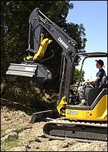 Mini excavator with mulcher